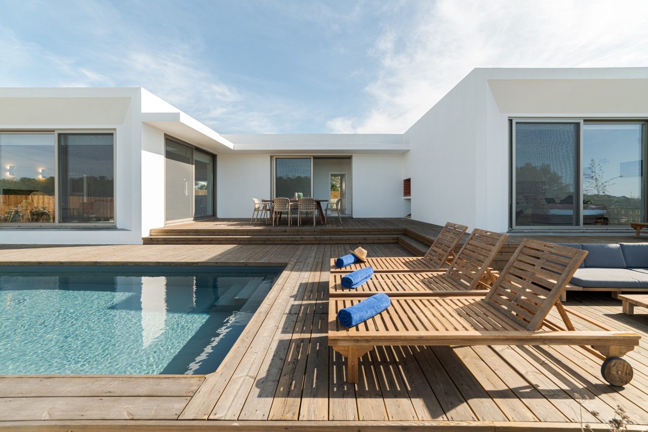 lounge-chairs-in-modern-villa-pool (1)